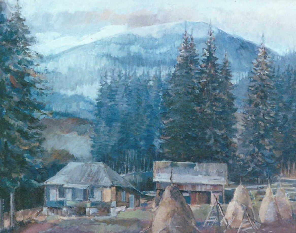 A mountain homestead with two houses and haystacks before a fir wood and a blue mountain.