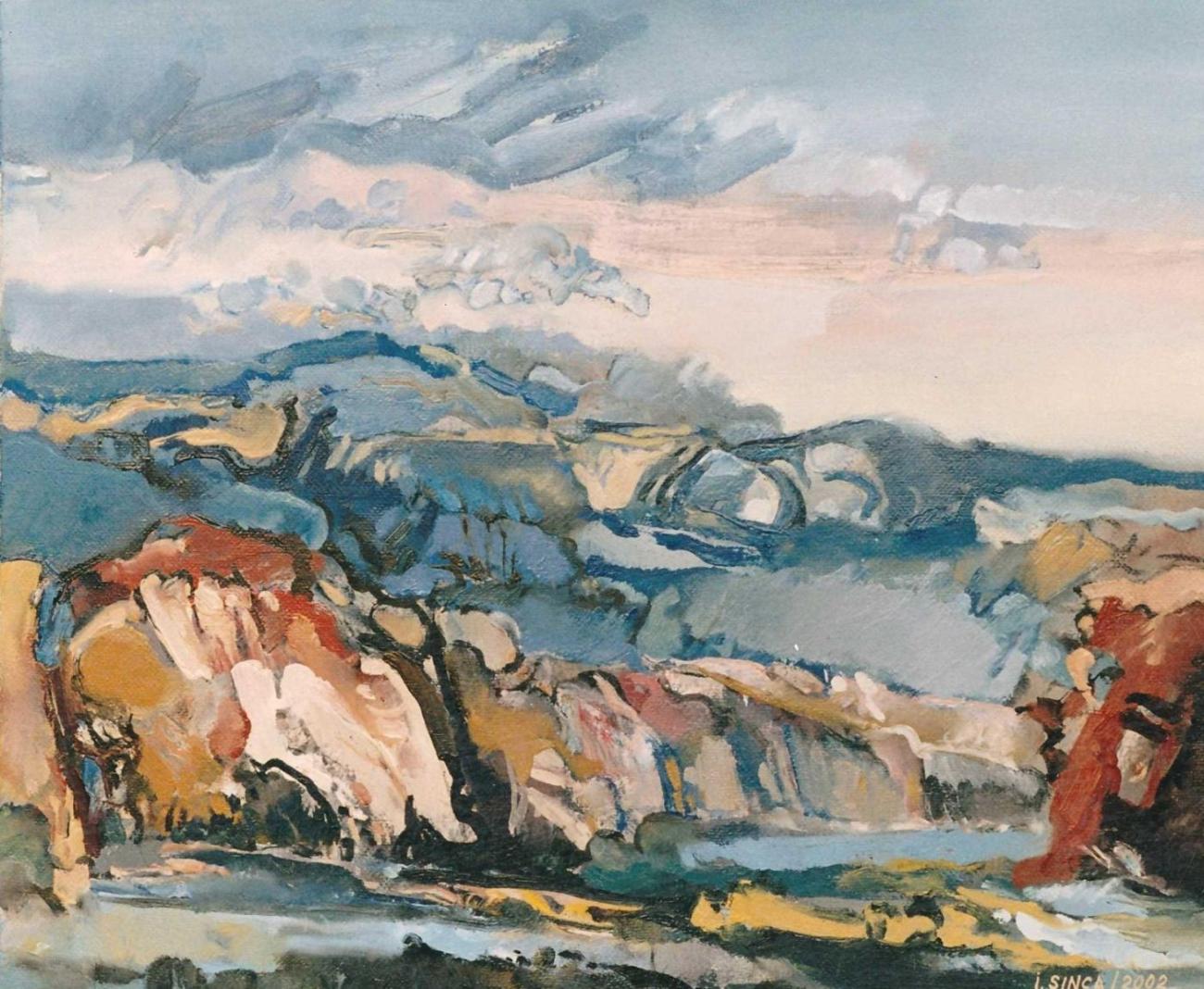 A ravine with white, red and ochre walls under a pink-grey sky with heavy clouds.