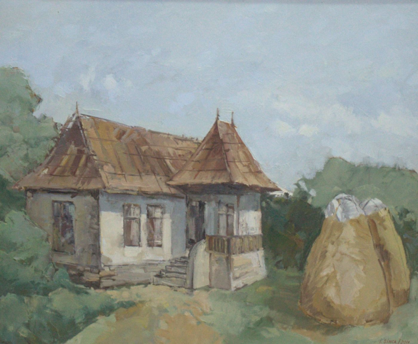 An old house with a rusty metal roof and a corner porch, with a haystack at the right.