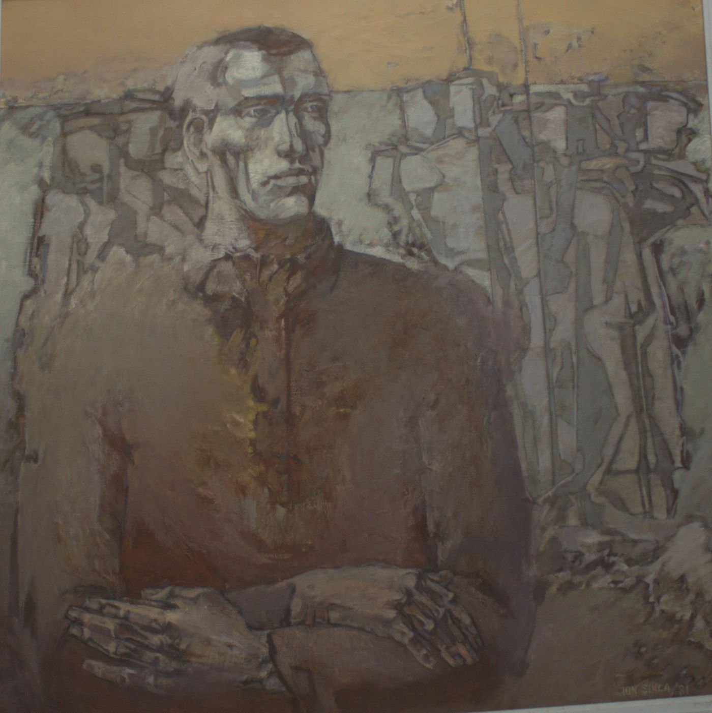 A frontal portrait of a heavy-set man with folded arms, against a ground of grey worker silhouettes.