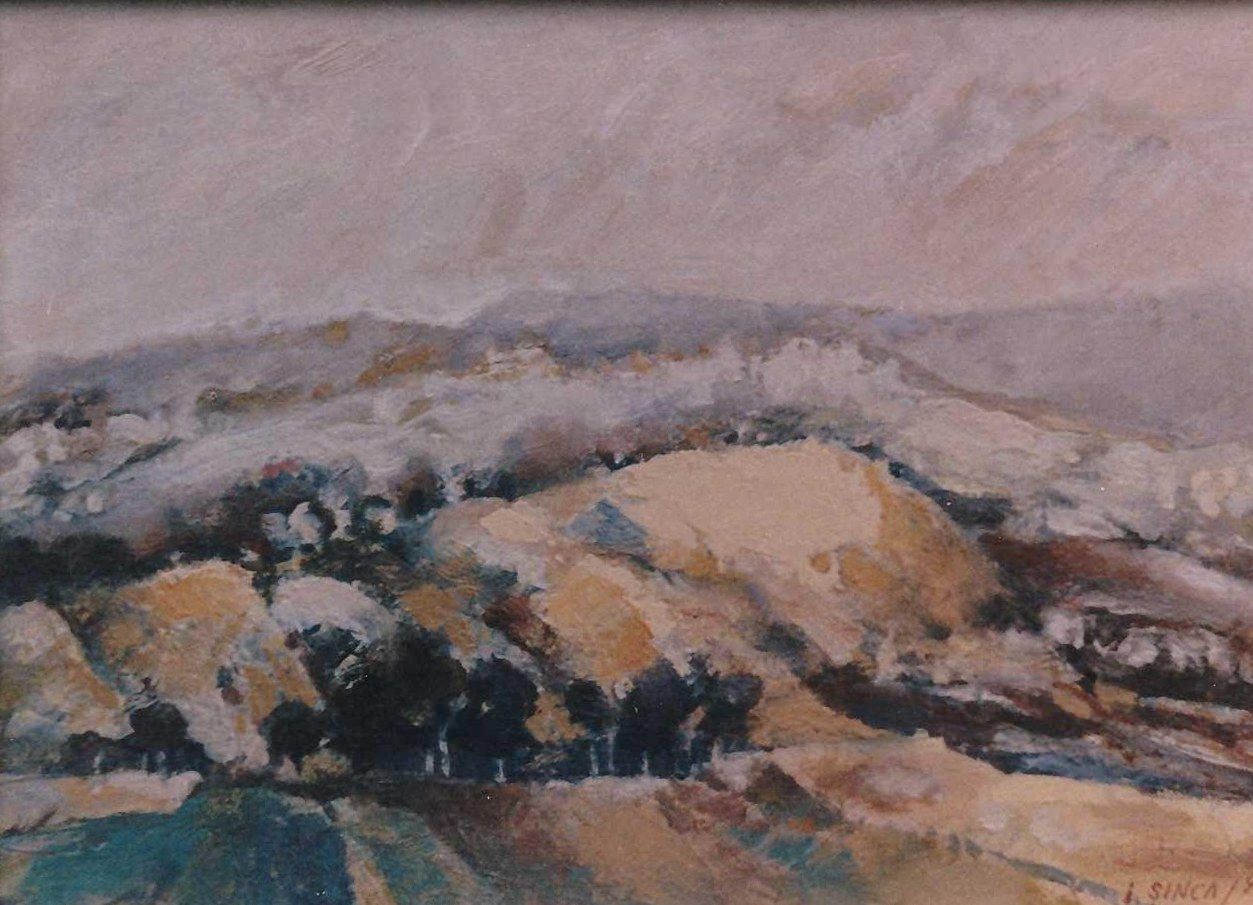 A run of golden-ochre hills with a stand of black trees at their base, under a pink-violet sky.
